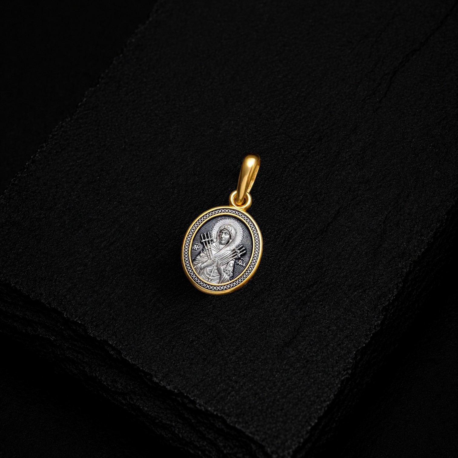 Icon of the Mother of God "Softener of Evil Hearts" (Seven Arrows). Icon pendant.